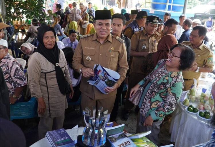Pj. Bupati Langkat H.M. Faisal Hasrimy Hadiri Expo Pangan Sehat dan Saresehan ke-37 di Desa Kebun Kelapa, Fokus pada Pertanian Berkelanjutan